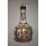 A Chinese Canton famille rose bottle vase and cover, late 19th century, 39.5cm high.