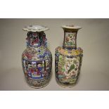 Two Chinese twin handled famille rose vases, 19th century, 44.5cm and 43.5cm high respectively, (