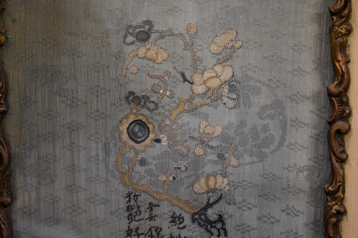 A pair of Chinese embroidered silk panels, decorated with birds in branches against a pale blue silk - Image 4 of 4