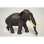 A good Japanese bronze elephant, Meiji, mark of Genryusai Seiya, with ivory tusks, 23cm high.