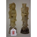 A pair of Chinese soapstone figures, 18cm high, (one restuck). (2)