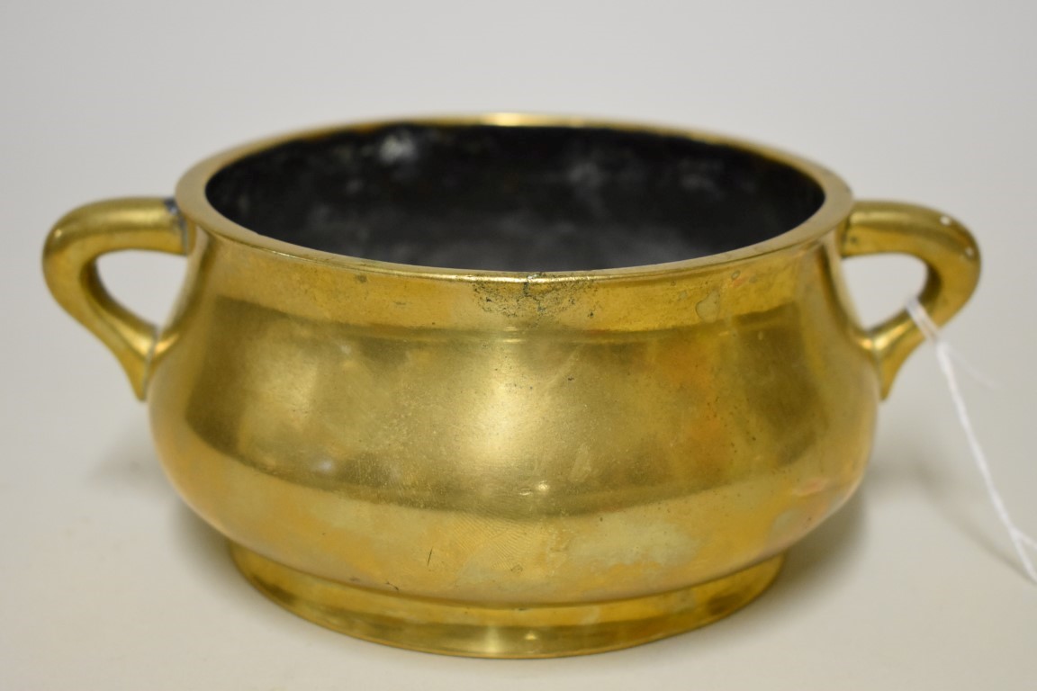 A Chinese bronze twin handled censer, Xuande six character mark, 19cm wide, 1101g.