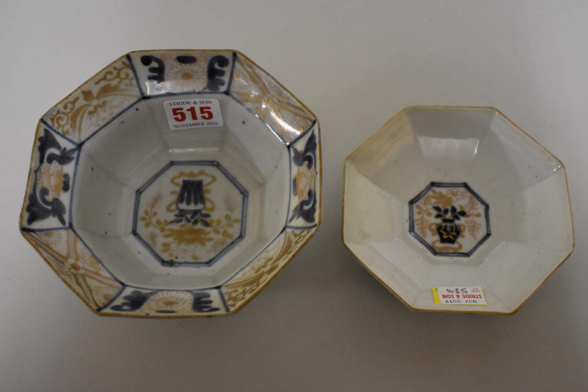 A Japanese porcelain octagonal rice bowl and cover, 19th century, gilt decorated in reserve panels