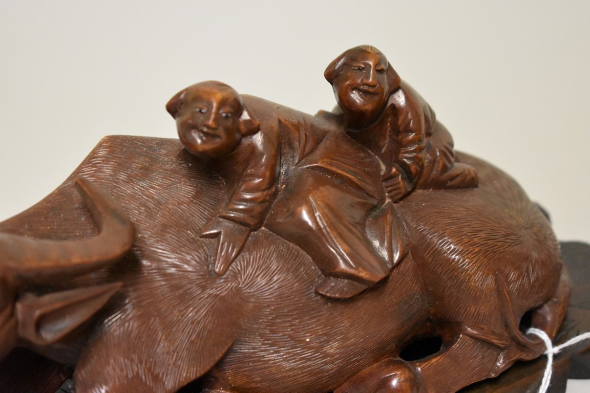 A pair of Chinese carved wood buffalo figure groups, late 19th century, each recumbent animal with - Image 3 of 5