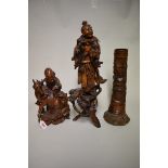 A Chinese carved rootwood figure, 54cm high; together with another Chinese carved wood figure group,