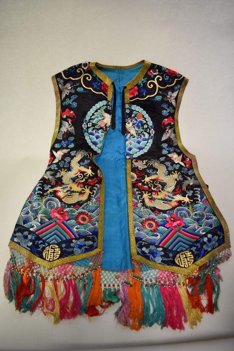 A Chinese embroidered silk robe/court waistcoat, decorated with five clawed dragons, bats, and birds