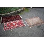 Three various rugs, largest 143 x 98cm.