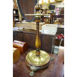 An unusual mahogany and brass circular stick stand, on paw feet, 60cm high.