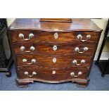 A George III mahogany serpentine fronted chest of drawers, with fitted top drawer, 90cm wide.