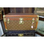 A vintage Au Touriste canvas, leather and brass bound small trunk, 30.5 high x 64cm wide x 36cm