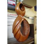 Manner of Dame Barbara Hepworth, untitled, a teak sculpture, 58cm high.Provenance: by repute