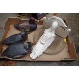 Three painted wood decoy ducks; together with a parrot wall bracket; and an oak bread board.
