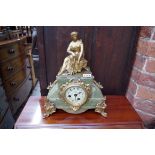 A Louis XVI style green onyx and gilt metal mantel clock, 34cm high, (lacking pendulum).