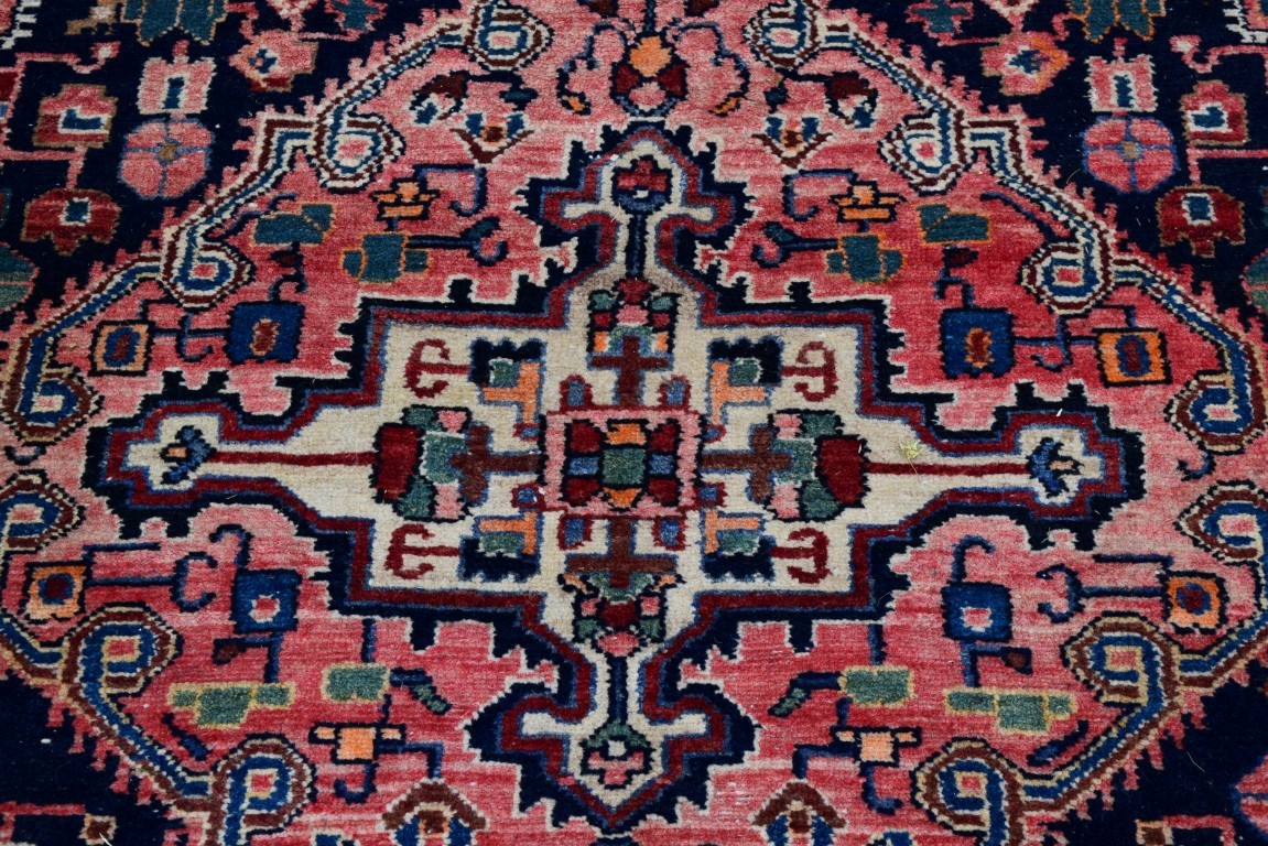 An Iranian rug, having red field with geometric design, 242 x 132cm. - Image 2 of 3