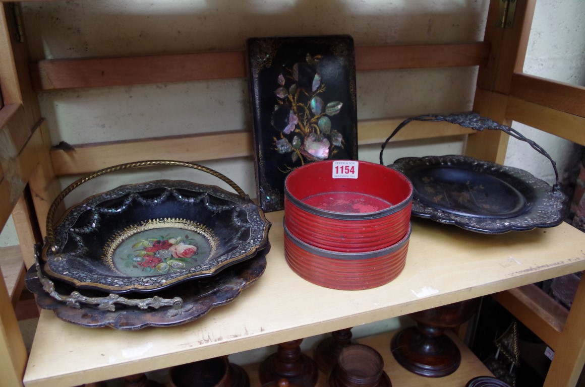 A collection of 19th century papier mache, to include three swing handled baskets; and a pair of