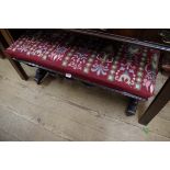 A Victorian carved oak and upholstered rectangular stool, 85cm wide.