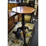 An antique mahogany octagonal tripod table, 42cm wide.