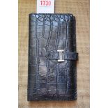 A Hermes Bearn bi-fold black alligator wallet, 19cm wide.