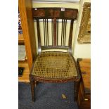 An early 19th century Continental painted and cane seat dining chair, with sabre legs to the front.