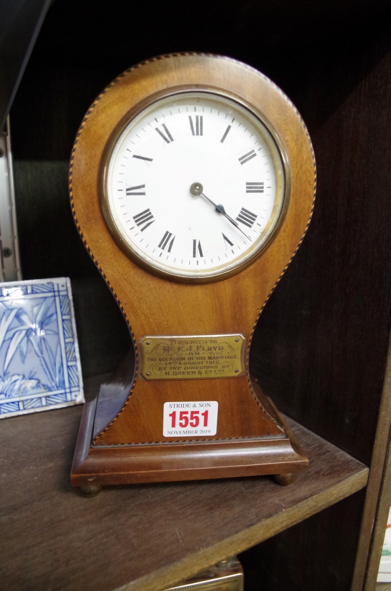 An Edwardian mahogany and chequer strung balloon timepiece, 24cm high.