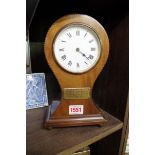 An Edwardian mahogany and chequer strung balloon timepiece, 24cm high.