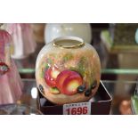 A Royal Worcester ovoid vase, painted with fruit, 7.5cm high.