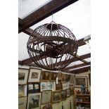 A steel spherical hanging gimbal oil lamp, 40cm diameter.