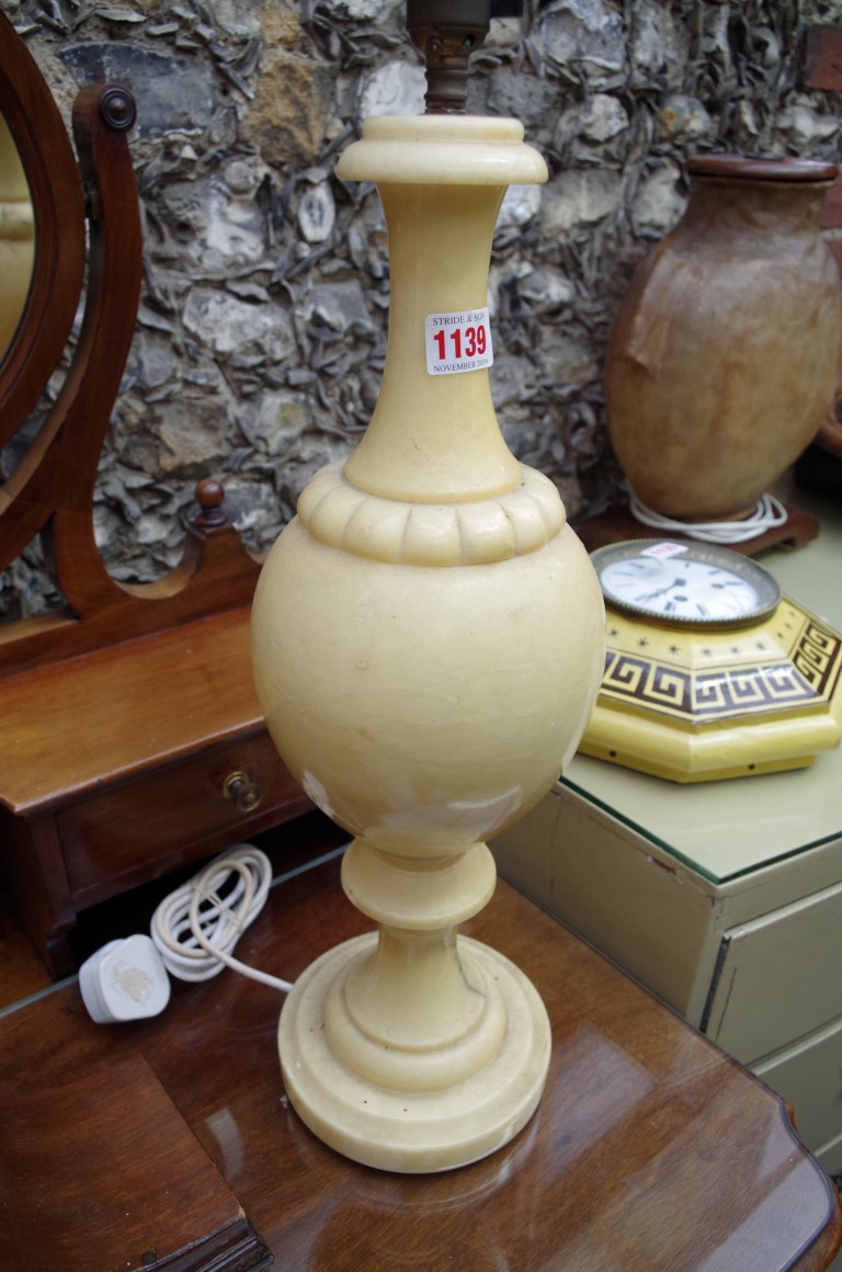 A large pair of alabaster table lamps, height excluding fitting 50cm.