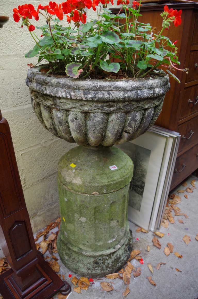 An old weathered composition stone urn and pedestal, 55cm diameter x 99cm high.