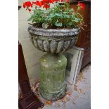 An old weathered composition stone urn and pedestal, 55cm diameter x 99cm high.