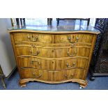 An 18th century colonial hardwood serpentine fronted chest of drawers, possibly padouk, with two