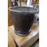An antique leather twin handled bucket, 39cm high.