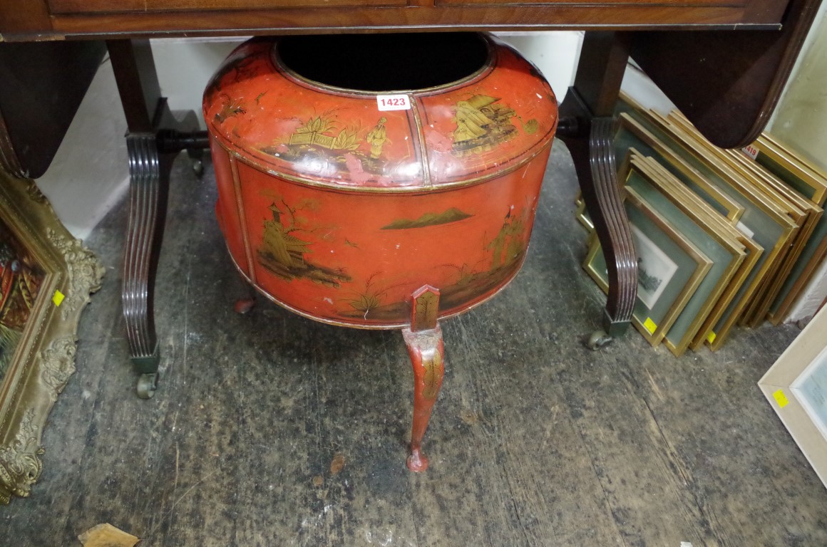 A red chinoiserie toleware jardiniere or log bin, on cabriole legs, 41.5cm diameter.