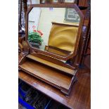 An unusual mahogany and crossbanded toilet mirror, 62.5cm wide.
