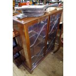 A circa 1900 mahogany bookcase, labelled 'Durce & Co Ltd...', 91.5cm wide.