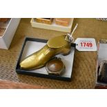 Trench Art: a shoe form snuffbox, 10.5cm long; together with a coin lighter.