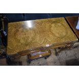 An 18th century style figured walnut card table, with concertina action and cabriole legs ending