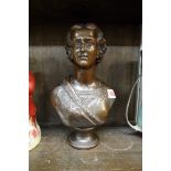 A bronzed bust of a lady, 30cm high.