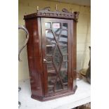 A mahogany miniature hanging corner cupboard, 29cm wide.