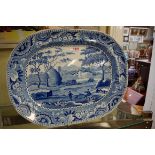 A 19th century English pottery blue and white meat plate, 48cm wide.