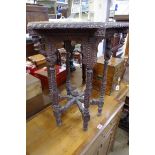 An Eastern carved hardwood small hexagonal occasional table, 50cm wide.