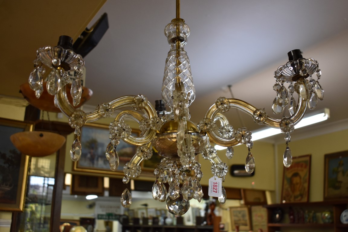 An old glass six branch chandelier.