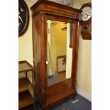 A 19th century pitch pine armoire, with mirror panelled door, 96cm wide.