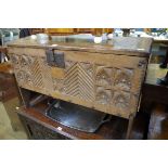 A 17th century carved oak boarded coffer, 95cm wide.