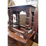 Two old carved oak joint stools, largest 45cm wide.