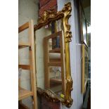 A reproduction gilt framed wall mirror, 76 x 49cm.