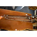 Four cello bows; together with another violin bow, stamped 'Meinl', (broken and restuck).