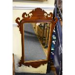 A mahogany fret framed wall mirror, 85 x 49.5cm.