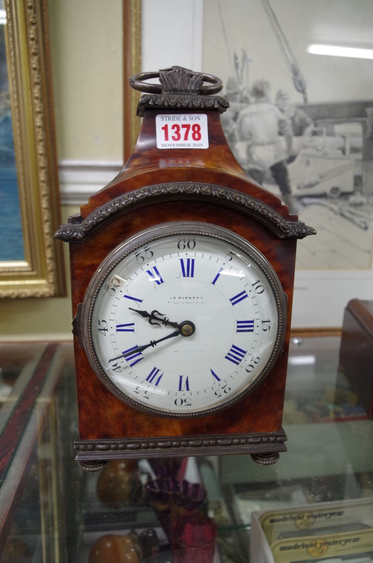 A Louis XVI style tortoiseshell and electroplate mounted mantel timepiece, 29cm high, with winding