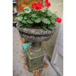 An old weathered composition stone urn and pedestal, 60cm diameter x 95cm high.